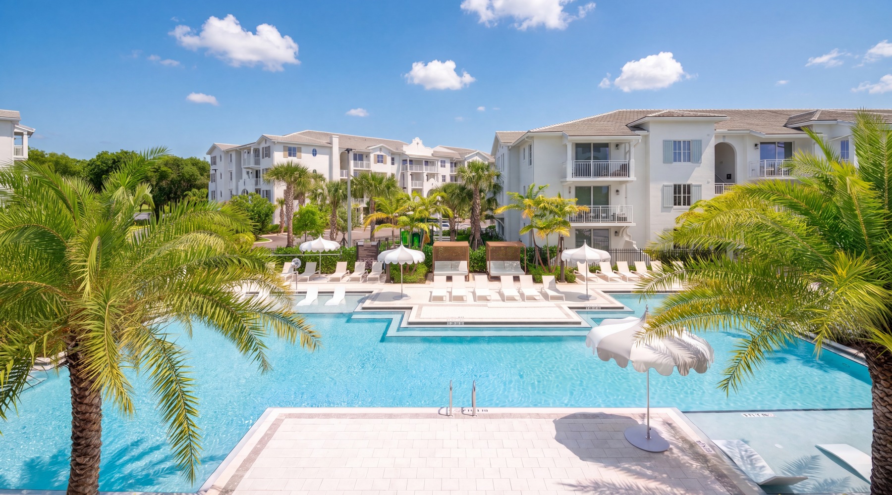 Resort-style pool with tanning ledge and cabanas at Sereno luxury apartments in Sunrise, Florida
