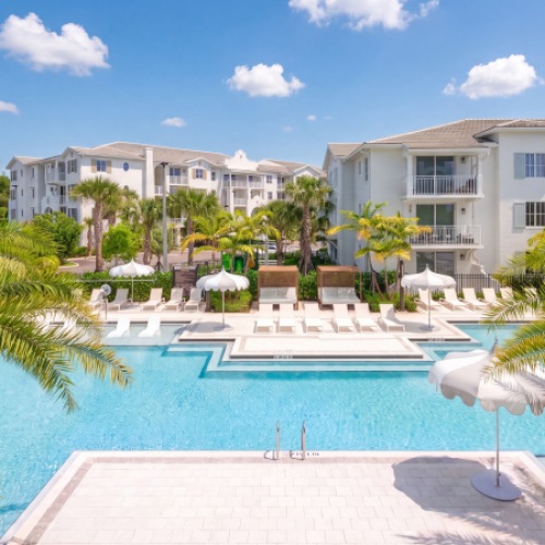 Resort-style pool with tanning ledge and cabanas at Sereno luxury apartments in Sunrise, Florida