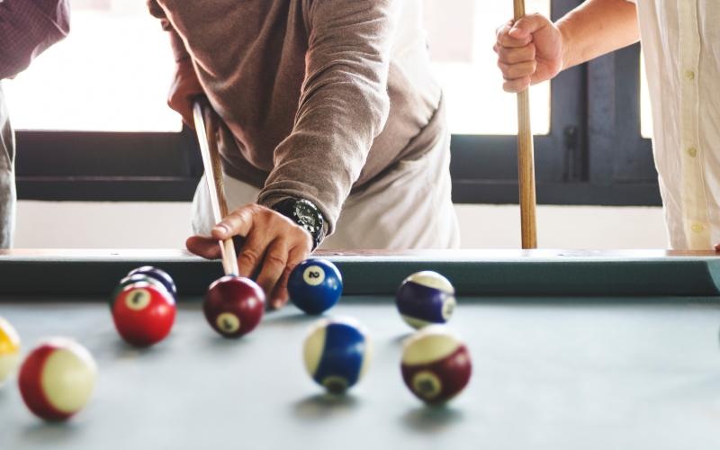 a person playing pool