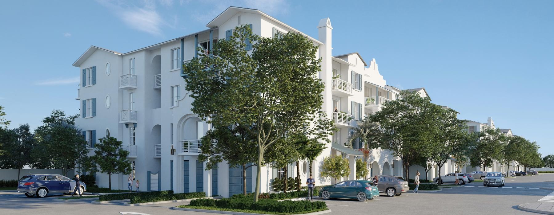 a large white building with trees in front of it