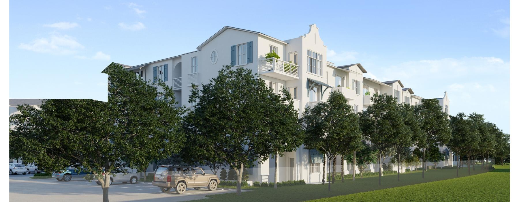 a white building with trees in front